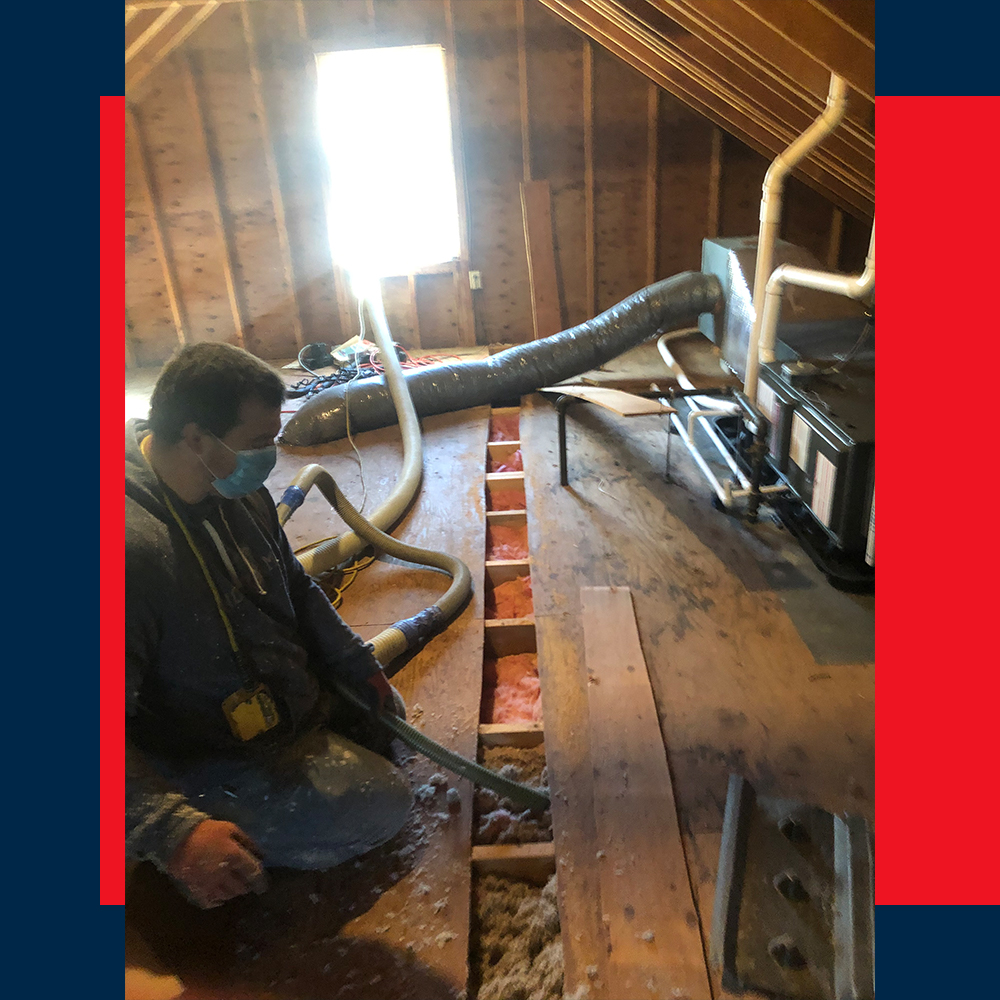 Image of a contractor working in an attic