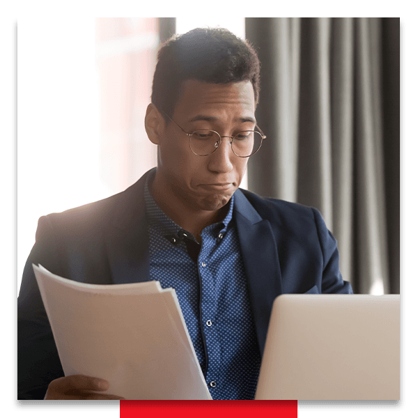 Image of a man looking at paperwork