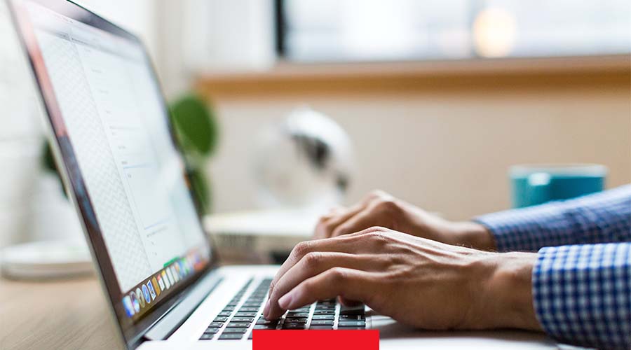 Image of a man using a laptop